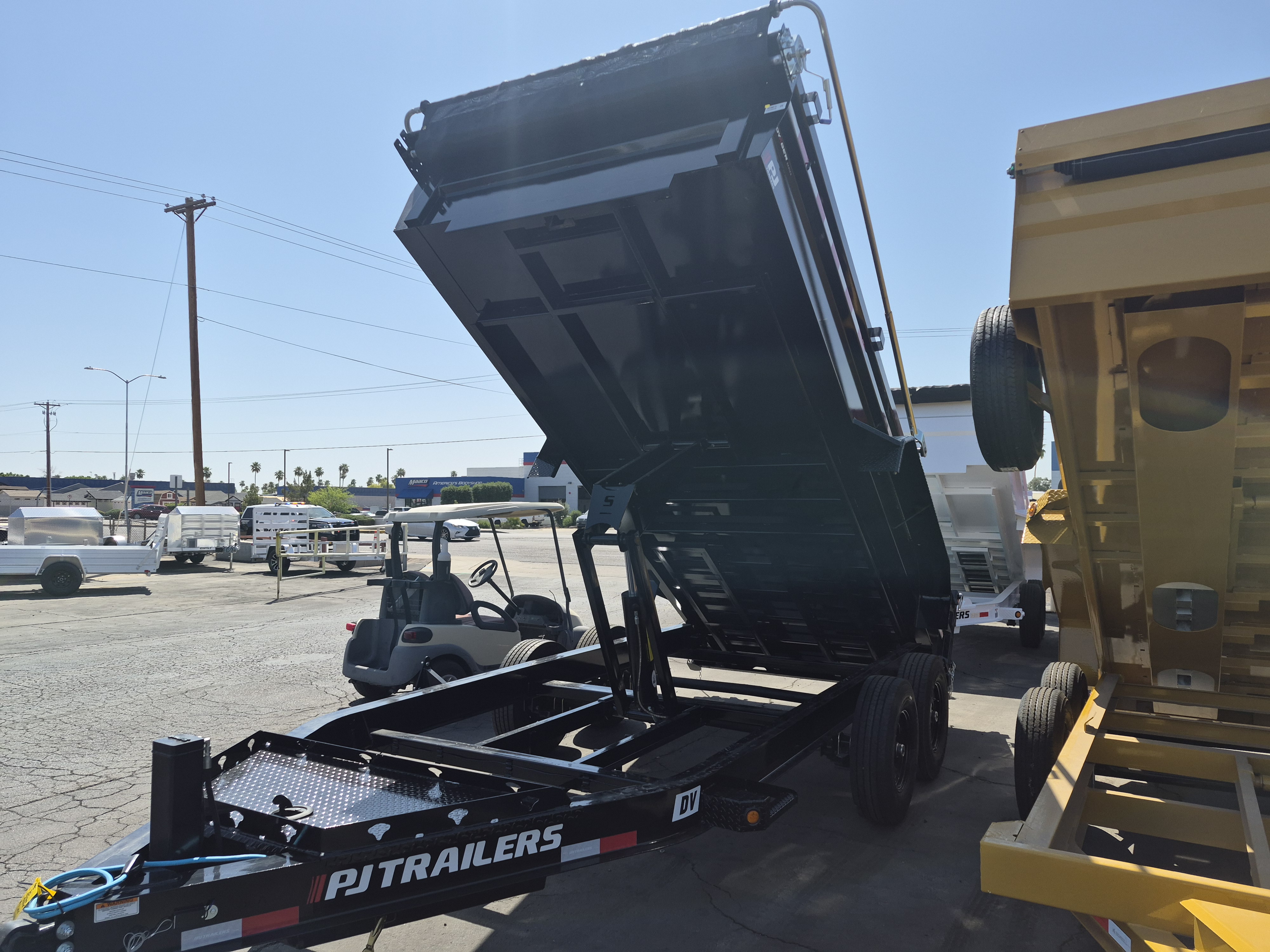 P.J. Trailers 16x83 Tandem Axle, 15,400 GVWR, Low Pro Dump, 24" Sides, 14 Ply Tires - Stock #PJD1660 - Image 1 of 4