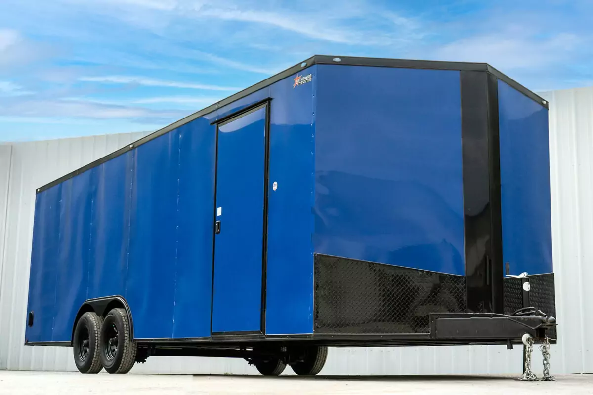 blue enclosed spartan cargo trailer