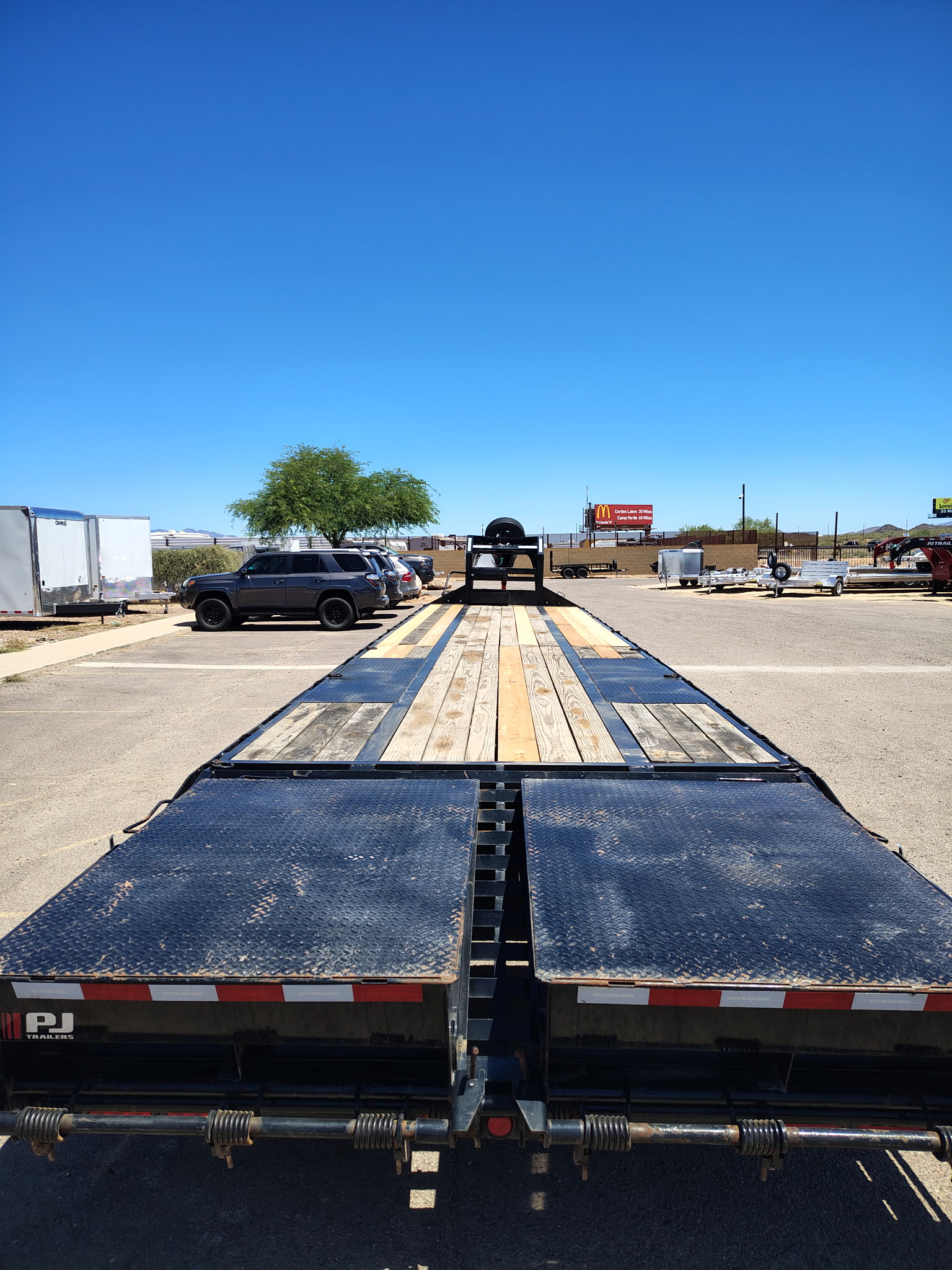 P.J. Trailers 40' Low-Pro Flatdeck w/ Duals, Air Ride, Elec/Hyd Disc brakes, 25K GVWR - Stock #USD8810 - Image 1 of 11